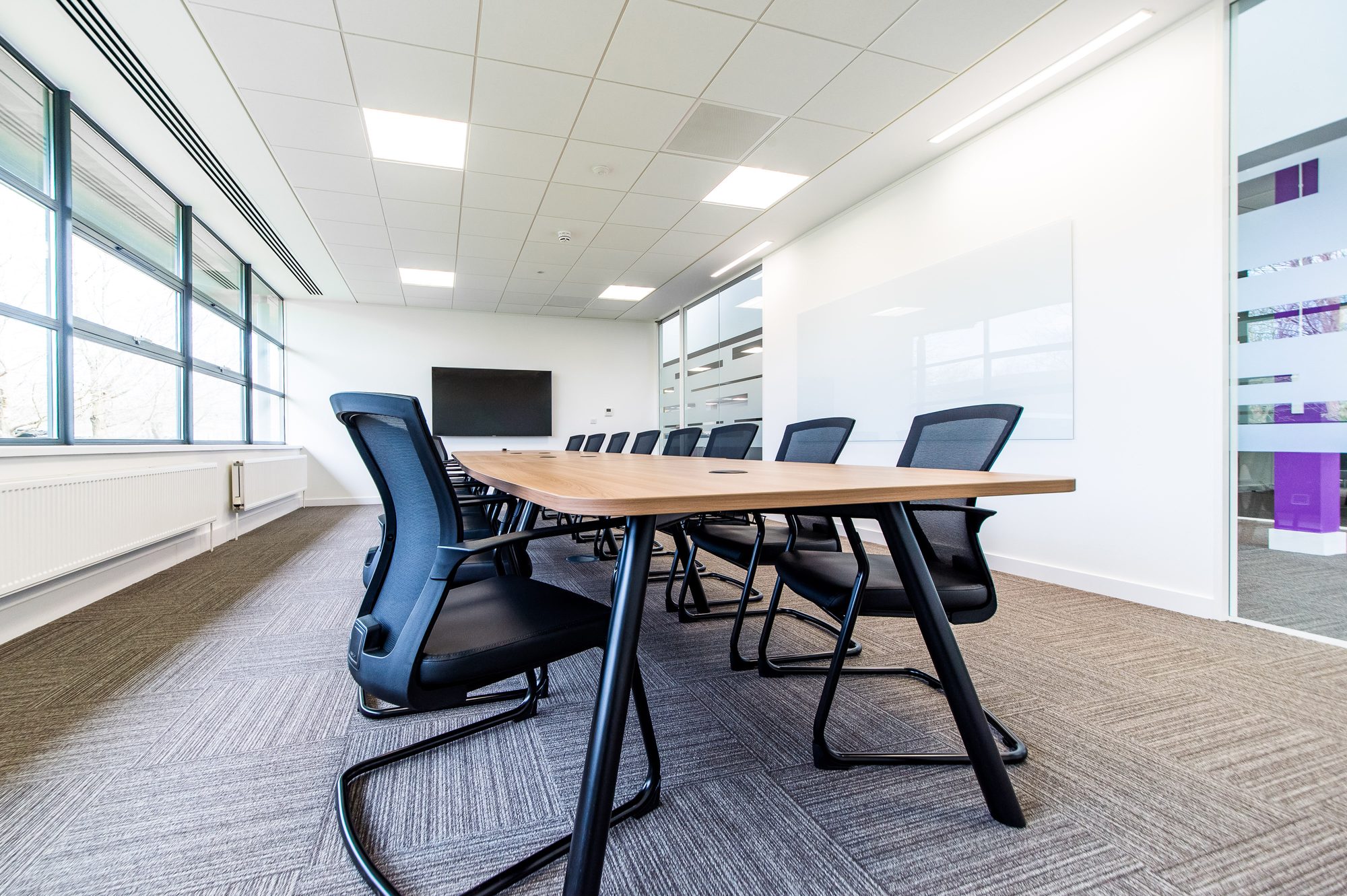 Boardroom alternative angle showing branded glass partition