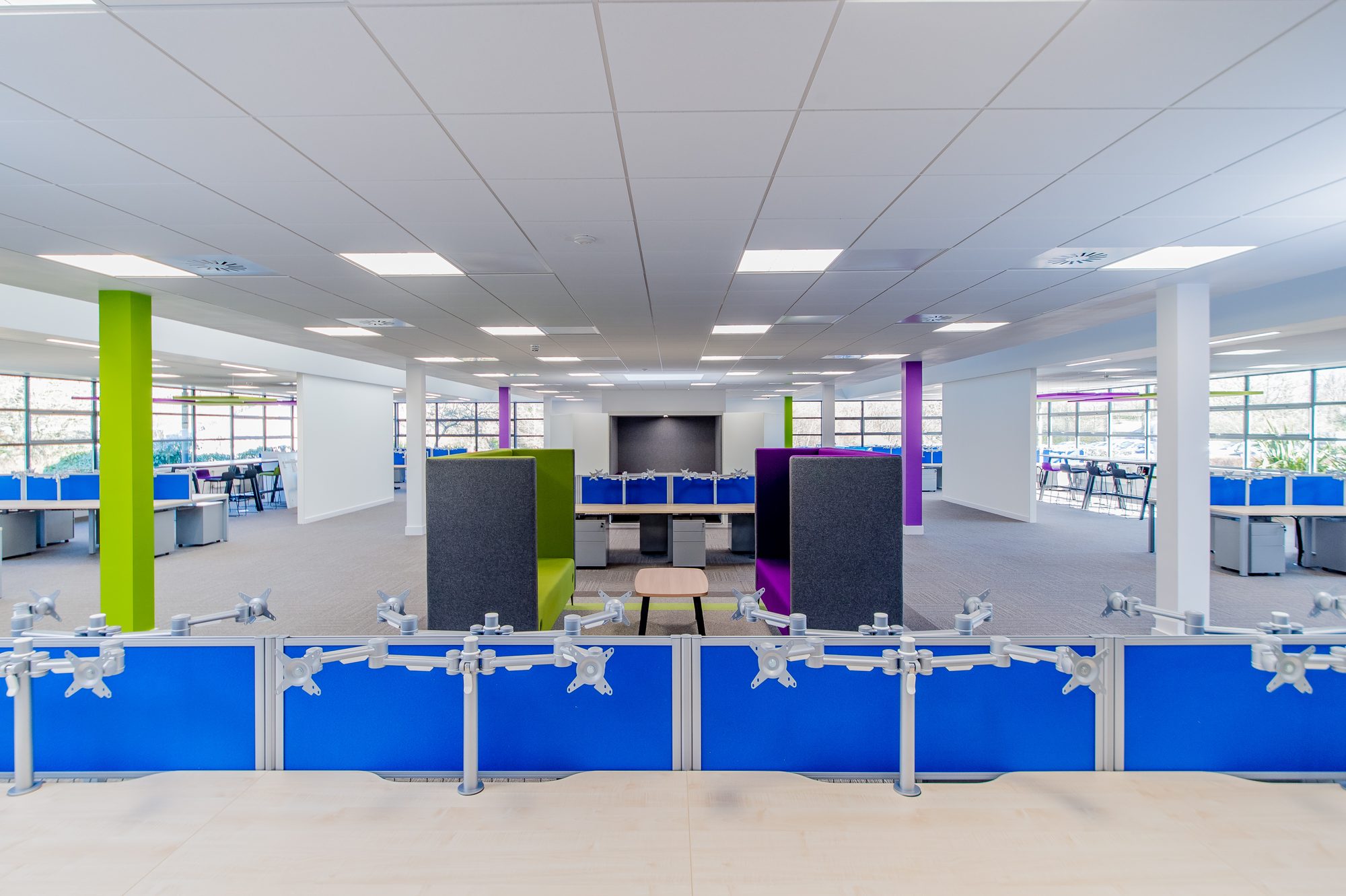 Open-plan desks running along the window line
