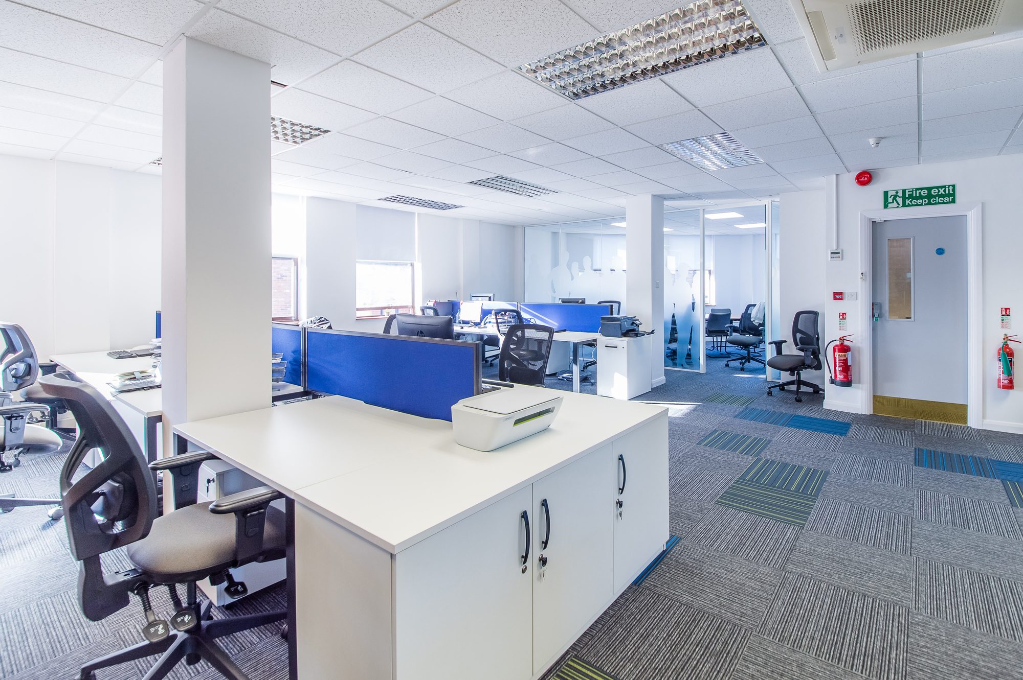 Open plan looking through to fire exit and glazed meeting rooms