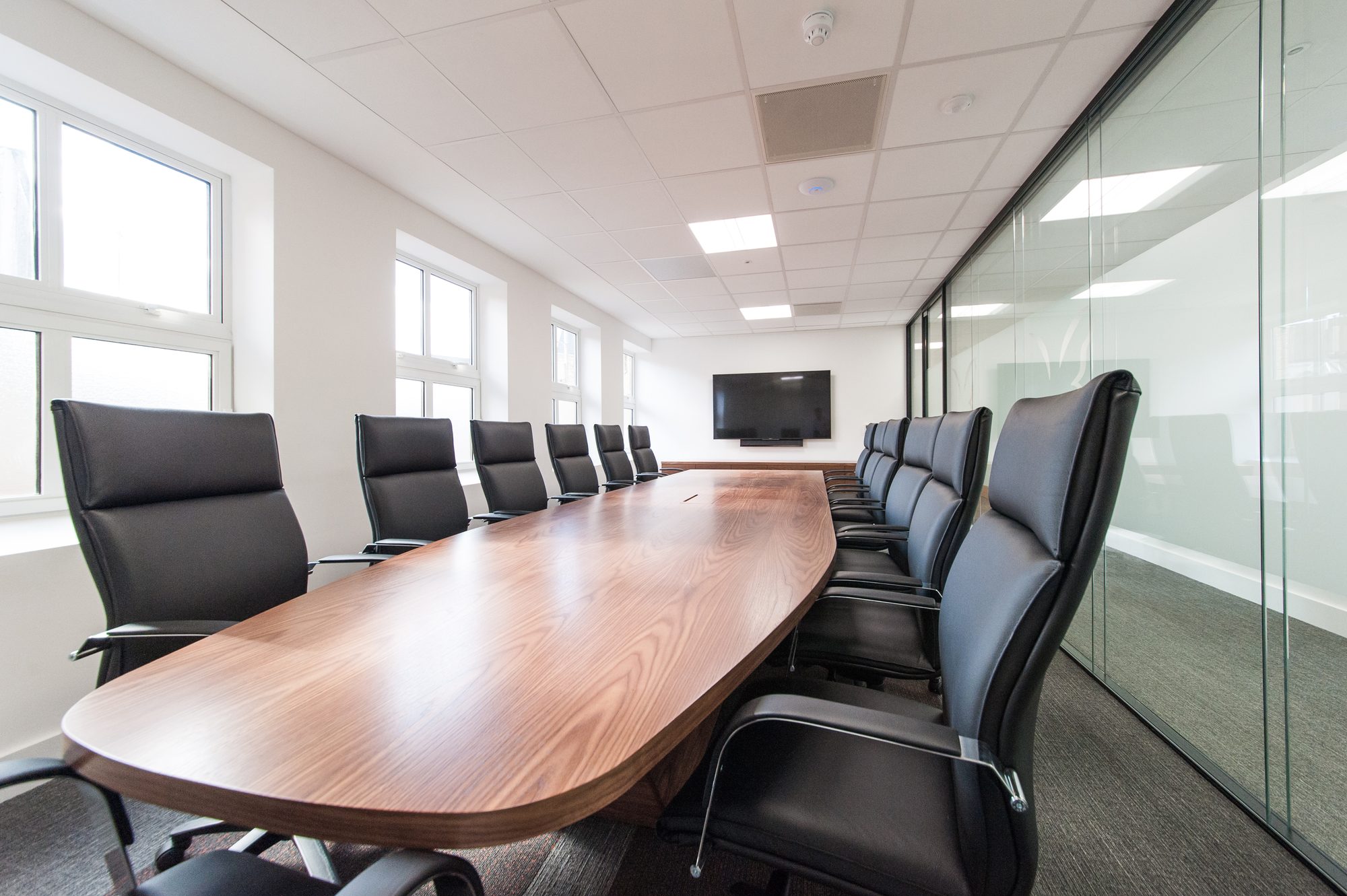 Boardroom from the other end showing TV screen and sash windows