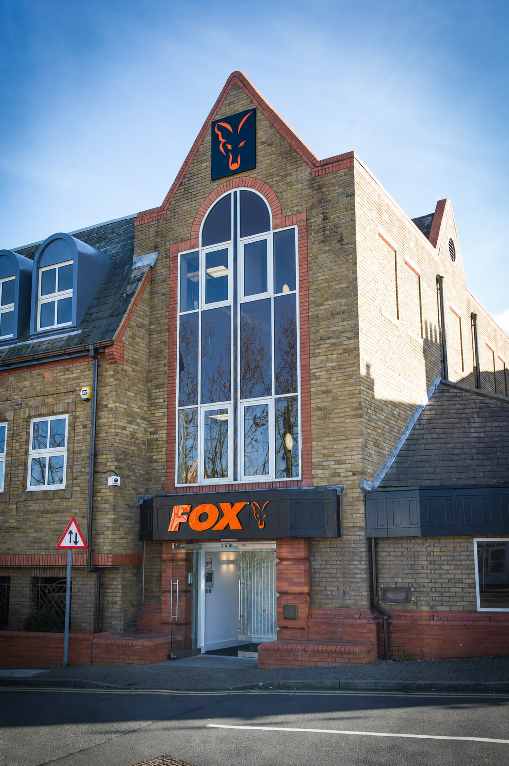 The finished building exterior with Fox signage and crest at the apex