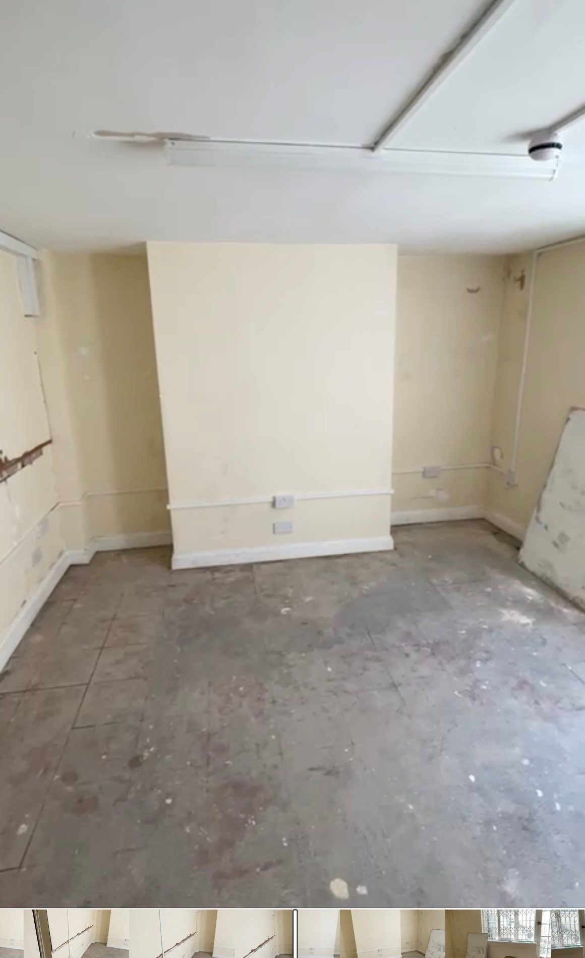 Second view of the empty unit before work began