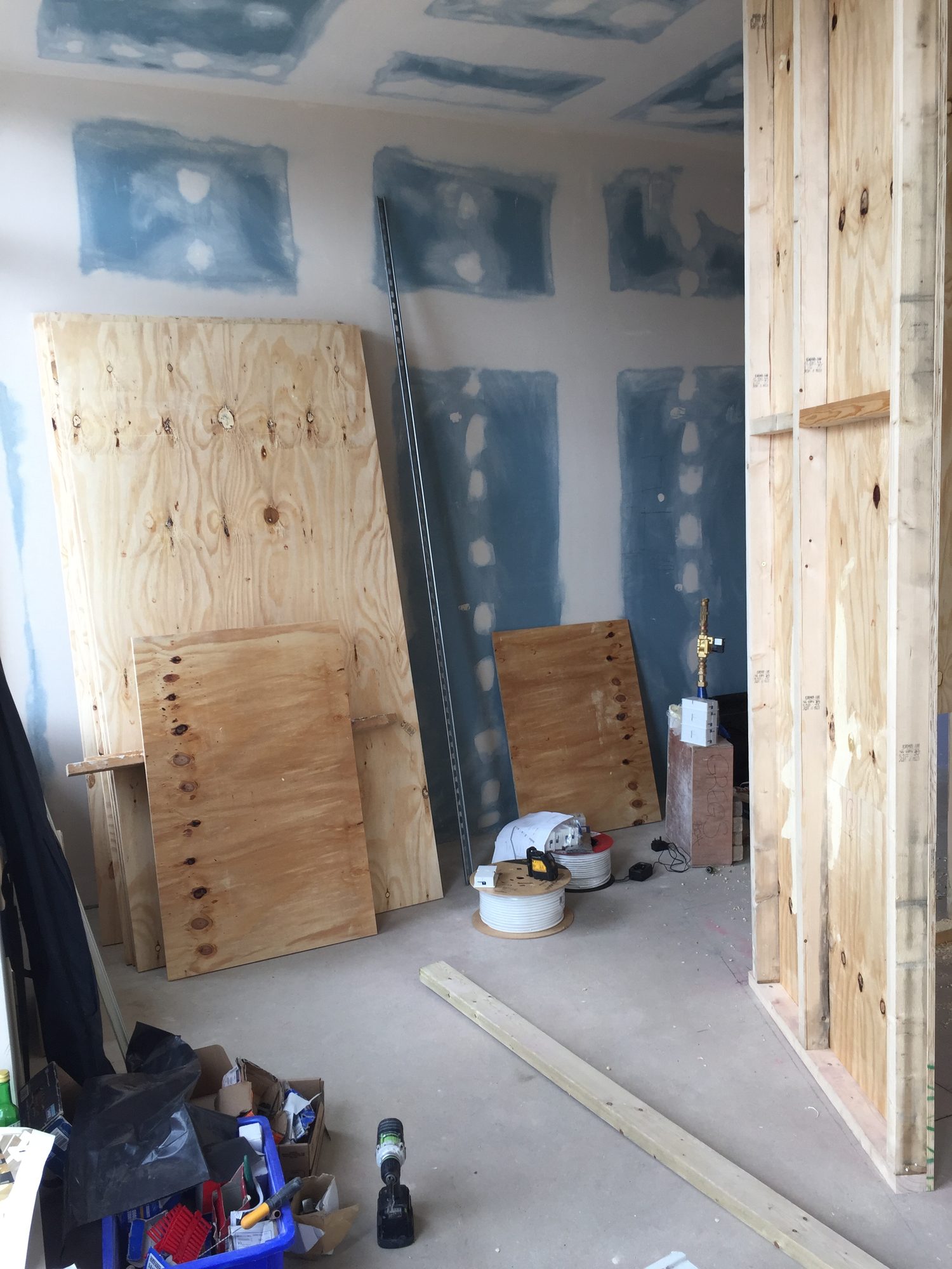 First-fix construction with plywood sheets and tools